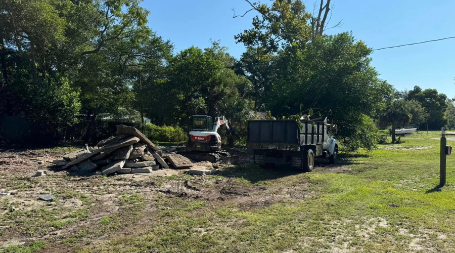 excavator doing a debris removal in a property
